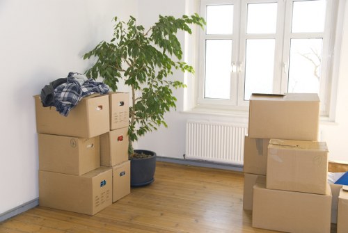 Man and van removals service operating in Paddington streets with moving boxes