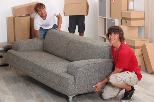 Removal van loading household items near a Paddington apartment building